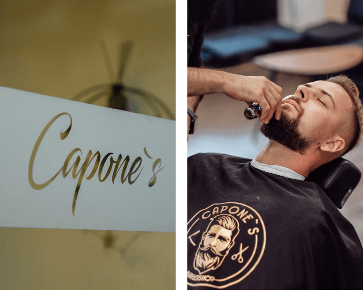 Links siehst Du das elegante Logo von Capone’s Barbershop in goldener Schrift. Rechts wird ein Kunde mit einem Barttrimmer professionell gepflegt, während er entspannt im Friseurstuhl sitzt.